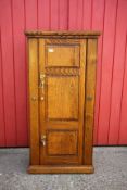 A GOOD QUALITY SOLID OAK STEEL LINED GUN SECURITY CABINET,