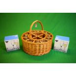 A WICKER CIRCULAR 12 GLASS BOTTLE HAMPER WITH 10 GLASSES AND 2 BOXES OF 6 AS NEW GLASSES