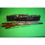 A MATCHED PAIR OF 20 BORE CAESAR GUERINI MAXUM SHOTGUNS PRESENTED IN THEIR TRANSIT CASES COMPLETE