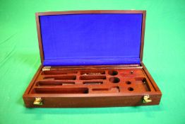 A QUALITY HARDWOOD GUN CLEANING CASE CONTAINING SMALL QTY RODS AND ACCESSORIES