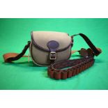 A QUALITY LEATHER AND CANVAS CARTRIDGE BAG ALONG WITH A QUALITY LEATHER CARTRIDGE BELT 12G