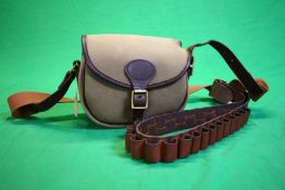 A QUALITY LEATHER AND CANVAS CARTRIDGE BAG ALONG WITH A QUALITY LEATHER CARTRIDGE BELT 12G