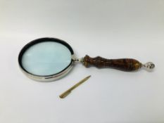 OVERSIZED MAGNIFYING GLASS ALONG WITH A VINTAGE PENCIL MARKED PAT.