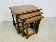 A GRADUATED NEST OF THREE SOLID OAK OCCASIONAL TABLES