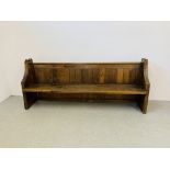 AN ANTIQUE OAK CHURCH PEW - W 215CM. D 49CM. H 89CM.