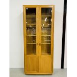 A MODERN ERCOL WINDSOR FULL HEIGHT PART GLAZED DISPLAY CABINET WIDTH 92CM DEPTH 32CM HEIGHT 214CM.