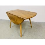 AN ERCOL BLONDE FINISH DROP FLAP DINING TABLE - LENGTH 113CM. WIDTH 61CM. EXTENDED 124CM.