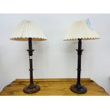 A PAIR OF SOLID OAK TURNED TABLE LAMPS WITH PLEATED SHADES