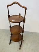 A MAHOGANY THREE TIER FOLDING CAKE STAND