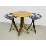 A RUSTIC CIRCULAR TOP OAK TABLE ON TRIPOD LEGS CONVERTED FROM WHISKY BARRELS ALONG WITH A PAIR OF