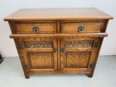AN OLD CHARM TWO DRAWER, TWO DOOR DRESSER BASE WITH CARVED LINEN FOLD DETAIL - W 93CM. D 44CM.