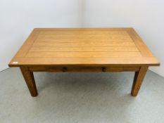 A SOLID LIGHT OAK RECTANGULAR COFFEE TABLE WITH SINGLE DRAWER - W 122CM. D 71CM. H 49CM.
