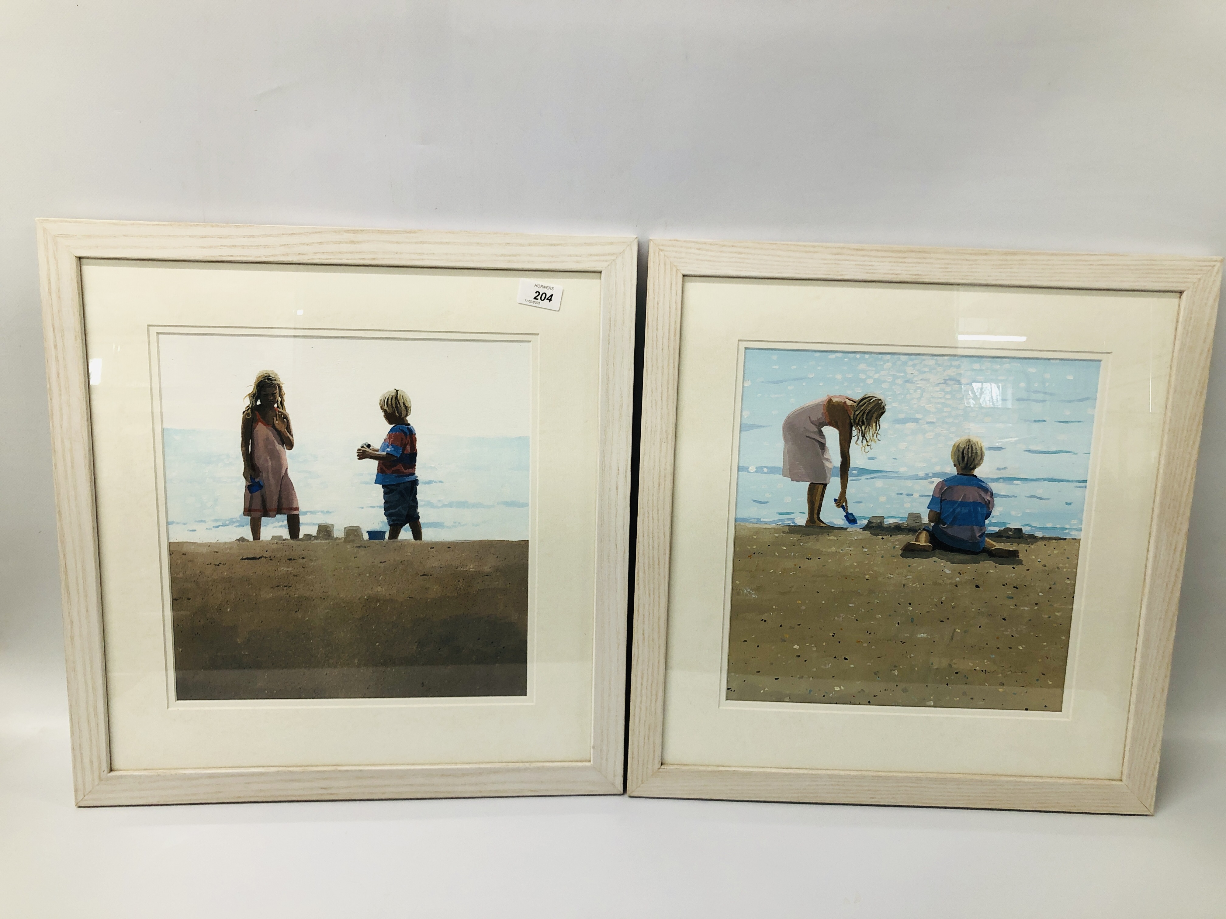 A PAIR OF CONTEMPORARY OIL ON BOARD BEACH SCENES SIGNED