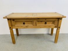 A MEXICAN PINE CORNER TWO DRAWER SIDE TABLE - W 127CM. D 48CM. H 74CM.