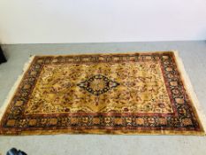 A MODERN RED AND BLUE PATTERNED ON YELLOW GROUND RUG 205 X 125CM.