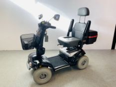 A ROAD LEGAL SHOPRIDER DELUXE MOBILITY SCOOTER COMPLETE WITH CHARGER,