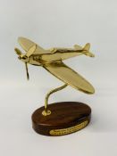 A BRASS SPITFIRE DESK TROPHY ON HARD WOOD BASE WITH PLAQUE "NEVER WAS SO MUCH OWED BY SO MANY TO SO