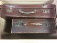TWO OLD SUITCASES WITH AN EXTENSIVE OLD-TIME ACCUMULATION IN ENVELOPES SORTED BY COUNTRY,