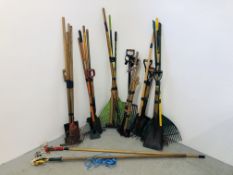A LARGE QUANTITY OF TOOLS TO INCLUDE SHOVELS, LEAF RAKES, SPADES, HOES, FORKS,