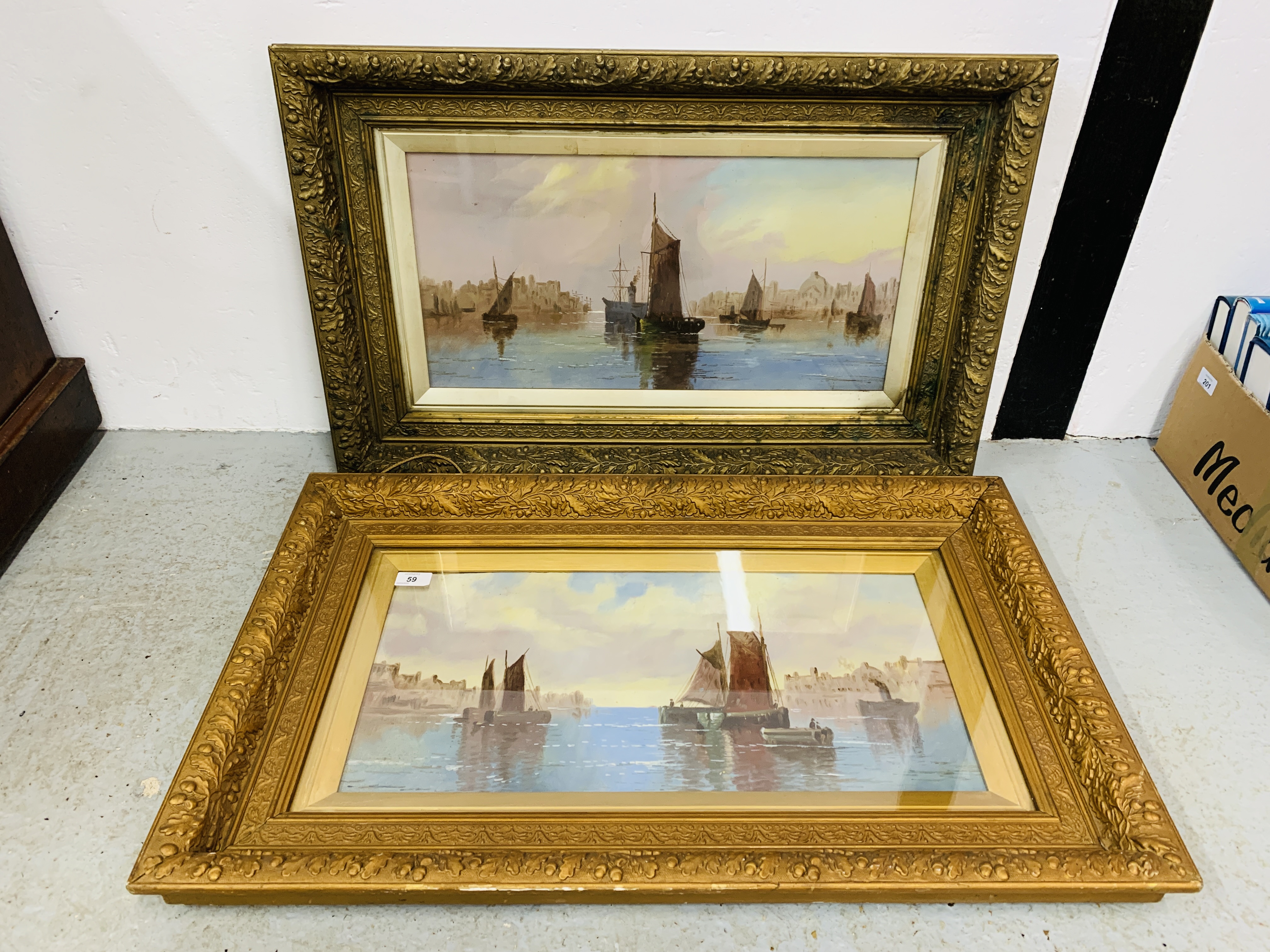 A PAIR OF GILT FRAMED OIL ON BOARD DEPICTING SAILING BOATS 59CM X 29CM.