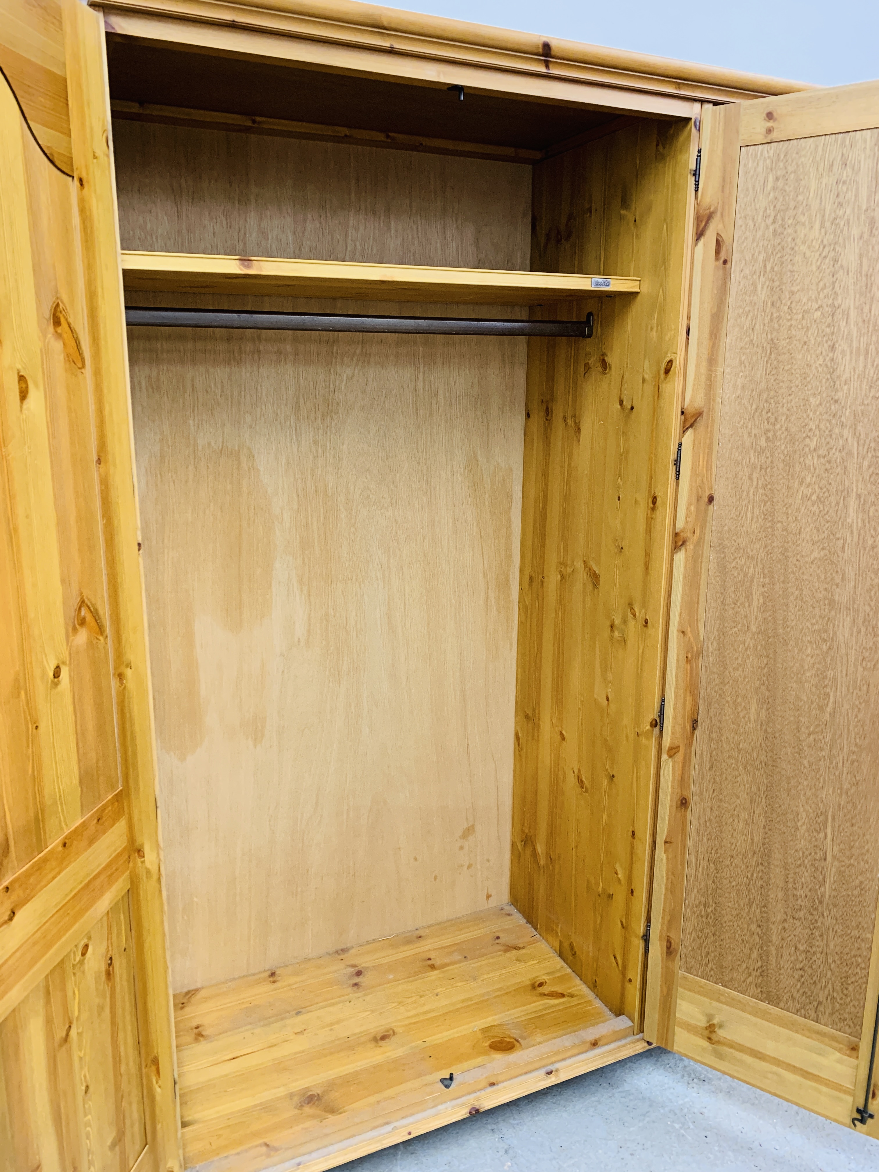 A GOOD QUALITY MODERN HONEY PINE TRIPLE WARDROBE WITH CENTRAL MIRRORED DRAWER MANUFACTURED BY - Image 12 of 12