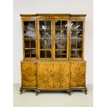 A GOOD QUALITY WALNUT FINISH BREAK FRONT BOOKCASE WITH FOUR CABINET DOORS TO BASE WIDTH 185CM.
