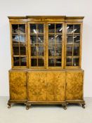 A GOOD QUALITY WALNUT FINISH BREAK FRONT BOOKCASE WITH FOUR CABINET DOORS TO BASE WIDTH 185CM.