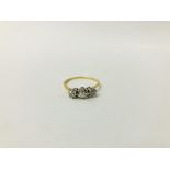 ANTIQUE YELLOW METAL (RUBBED MARKS) THREE STONE DIAMOND RING