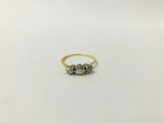 ANTIQUE YELLOW METAL (RUBBED MARKS) THREE STONE DIAMOND RING