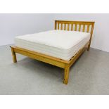 A MODERN HONEY PINE DOUBLE BEDSTEAD WITH BRITISH BED COMPANY "HOTEL REST DELUXE" MATTRESS.