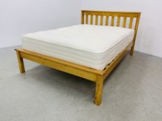 A MODERN HONEY PINE DOUBLE BEDSTEAD WITH BRITISH BED COMPANY "HOTEL REST DELUXE" MATTRESS.