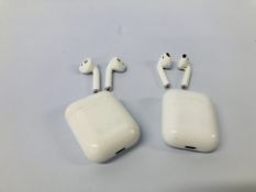 TWO PAIRS OF APPLE EAR PODS WITH CHARGING CASES - NO GUARANTEE OF CONNECTIVITY. SOLD AS SEEN.