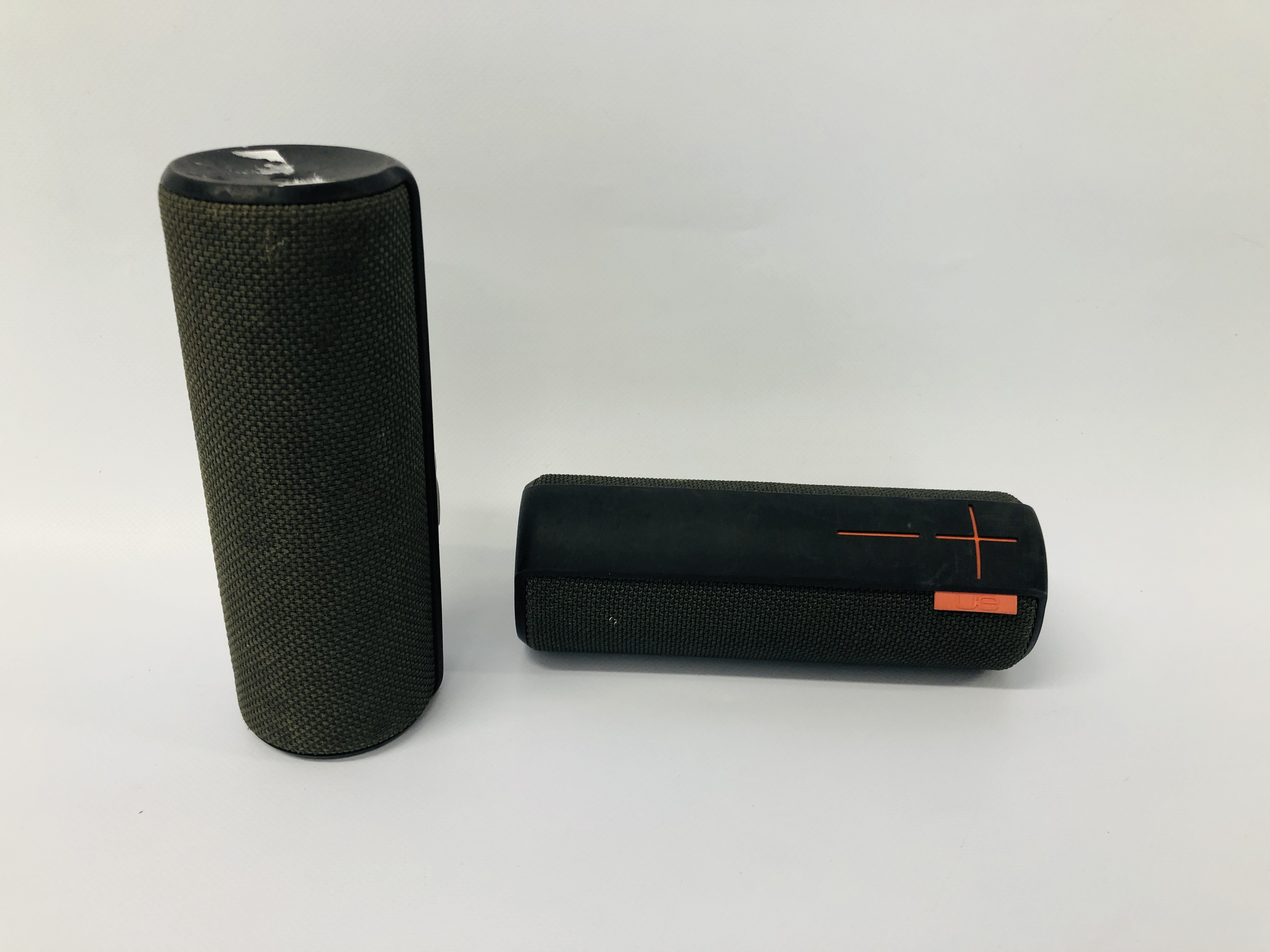 2 X UE BOOM PORTABLE BLUETOOTH SPEAKERS - NO GUARANTEE OF CONNECTIVITY. SOLD AS SEEN.