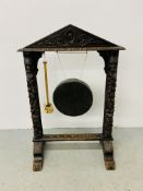 VINTAGE CARVED BLACKFOREST TYPE SURROUND INSET WITH A GONG HEIGHT 101CM. WIDTH 69CM.