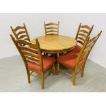 A HARDWOOD CIRCULAR DINING TABLE ON CENTRAL PEDESTAL COMPLETE WITH FIVE LADDER BACK RED UPHOLSTERED
