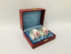 A PAIR OF HEREND HAND PAINTED NAPKIN RINGS IN BOX.