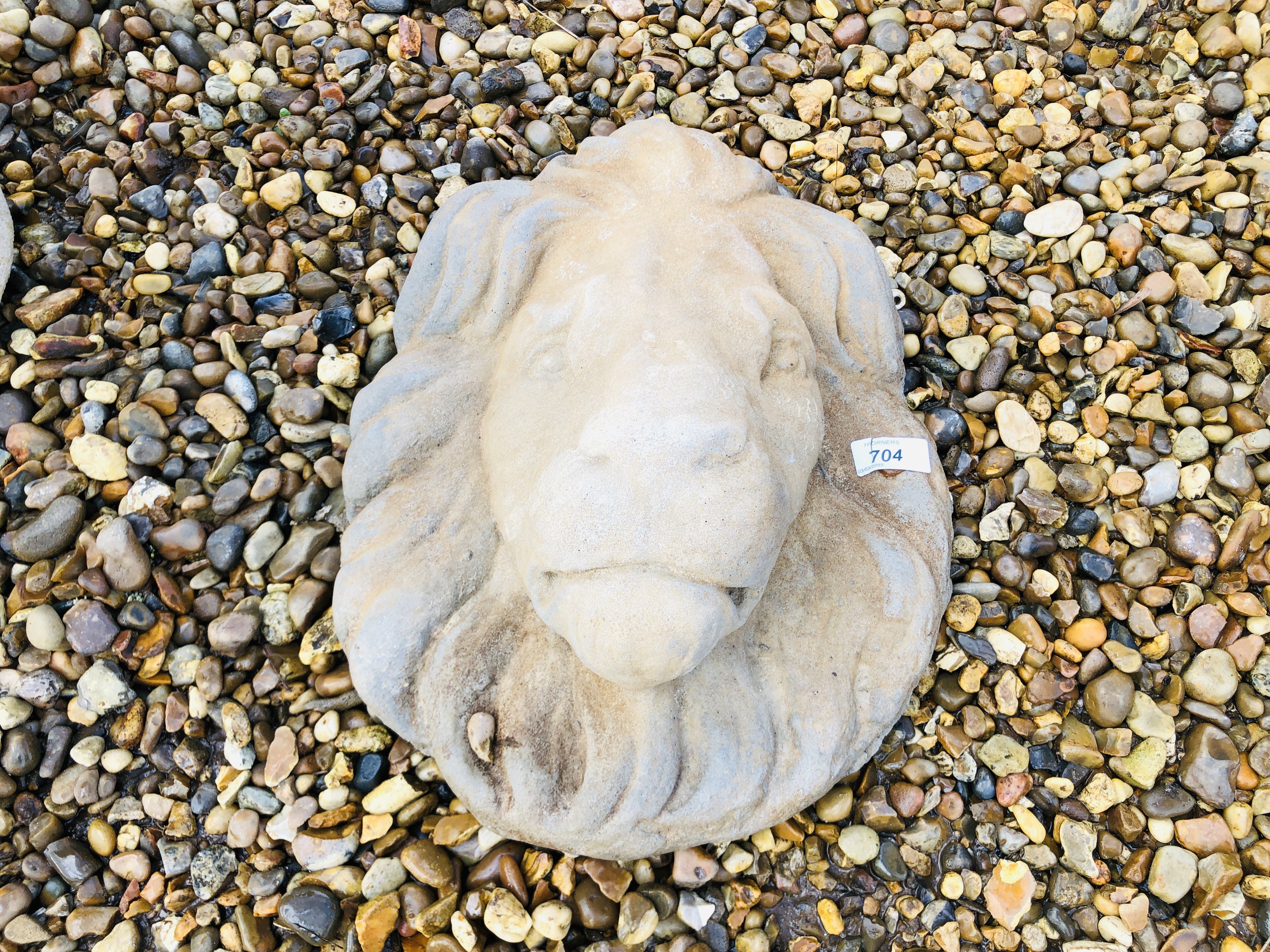 A STONEWORK "LIONS HEAD" WALL MASK HEIGHT 38CM. WIDTH 30CM.