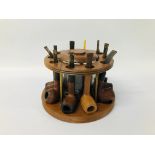 HARDWOOD CIRCULAR PIPE STAND WITH CENTRAL GLASS TOBACCO JAR COMPRISING 10 ASSORTED PIPES,