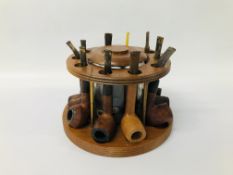 HARDWOOD CIRCULAR PIPE STAND WITH CENTRAL GLASS TOBACCO JAR COMPRISING 10 ASSORTED PIPES,