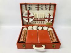 A VINTAGE SIRRAM SIX PERSON PICNIC SET IN RED TRAVEL CASE.