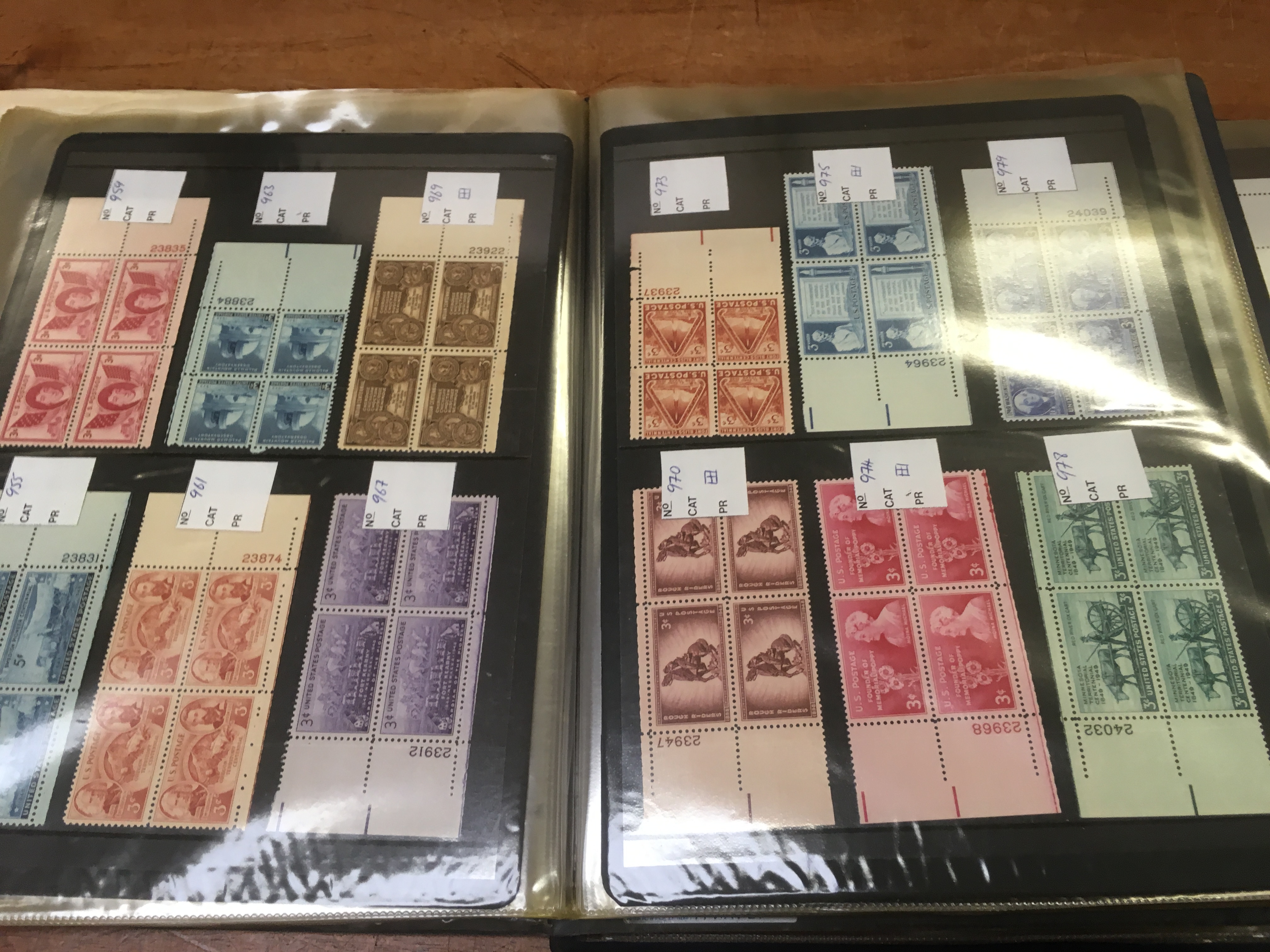 USA MINT STAMP COLLECTION IN THREE FOLDERS.