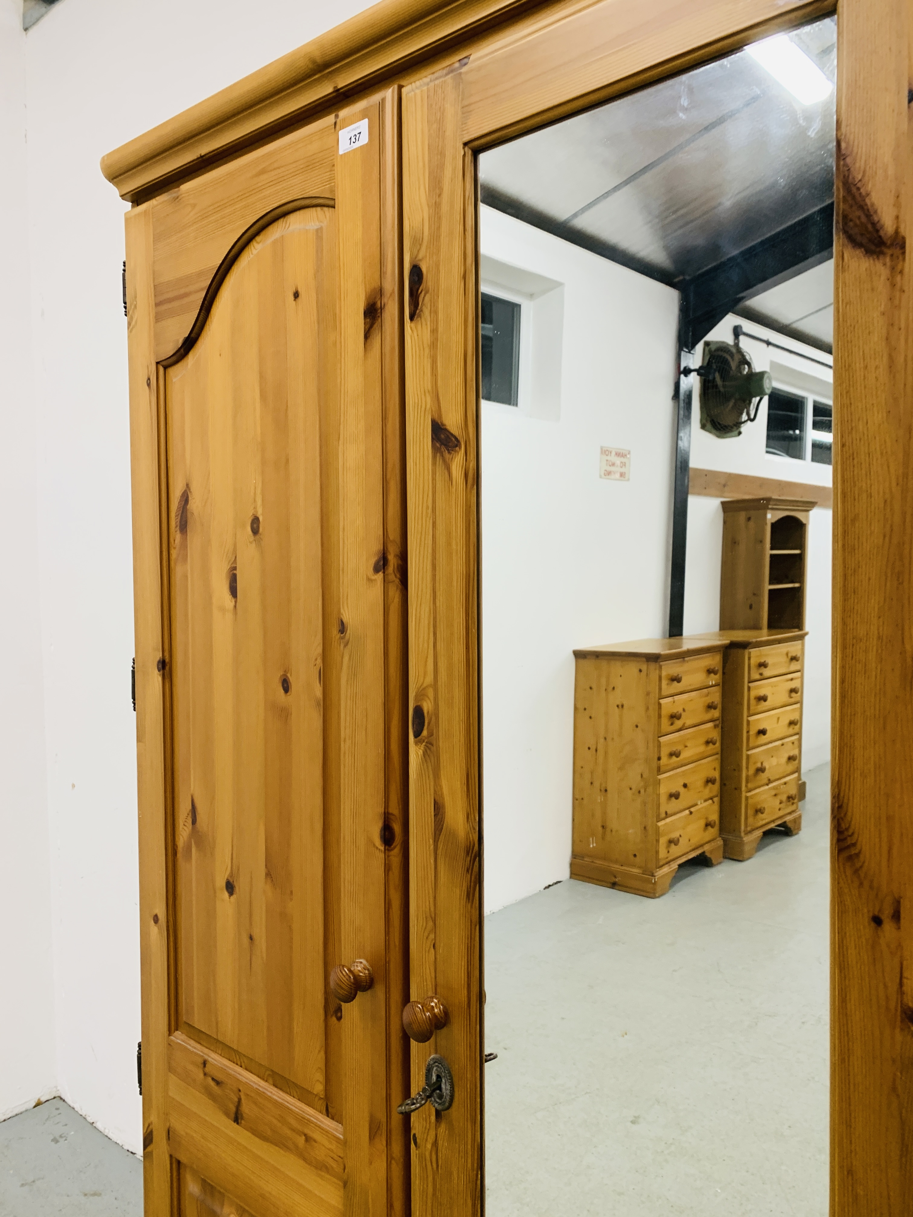 A GOOD QUALITY MODERN HONEY PINE TRIPLE WARDROBE WITH CENTRAL MIRRORED DRAWER MANUFACTURED BY - Image 5 of 12