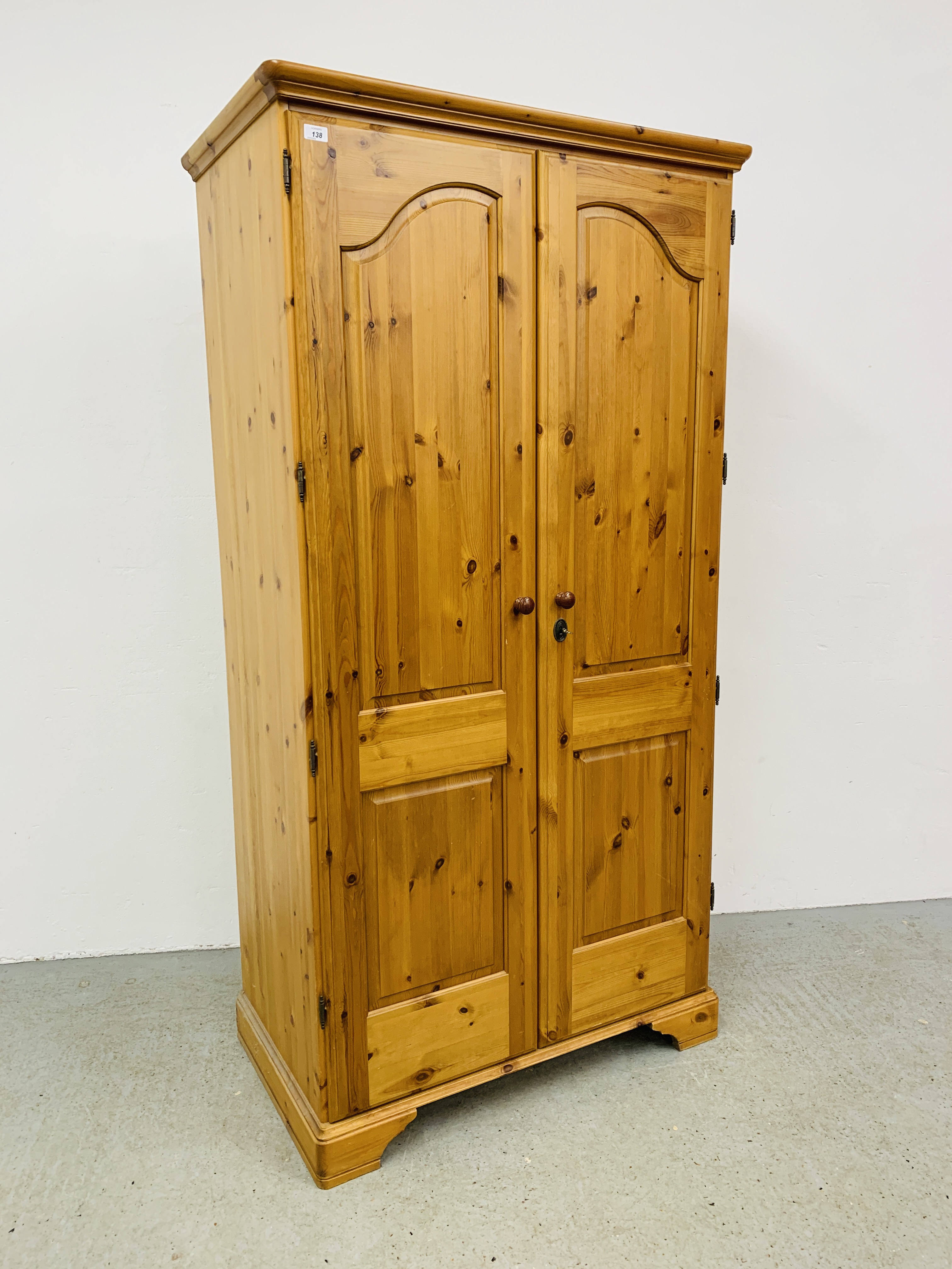 A GOOD QUALITY MODERN HONEY PINE DOUBLE WARDROBE MANUFACTURED BY LINDALE FURNISHINGS W 98CM, D 56CM,