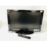 A LOGIK FLATSCREEN TELEVISION SET WITH STAND AND ACCESSORIES - SOLD AS SEEN