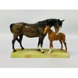 A BESWICK MODEL OF A BAY MARE WITH FOAL ON BASE