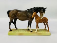 A BESWICK MODEL OF A BAY MARE WITH FOAL ON BASE