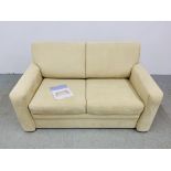 A JOHN LEWIS CREAM SUEDE TWO SEATER SOFA BED.