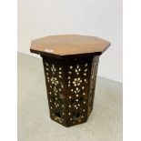 AN OCTAGONAL CARVED SIDE TABLE WITH MOTHER OF PEARL INLAY AND CARVED DETAIL