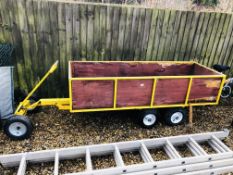 A WHEELED TWIN AXLE GARDEN TRAILER ON 13 INCH WHEELS 200CM. X 70CM. (BODY LENGTH) 340CM.