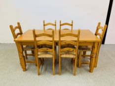 HONEY PINE DINING TABLE WITH CENTRAL SINGLE DRAWER ALONG WITH SIX LADDER BACK DINING CHAIRS (TABLE